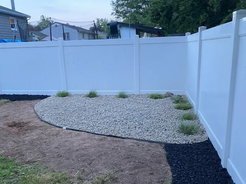 Privacy Fence with River-Rock Bed